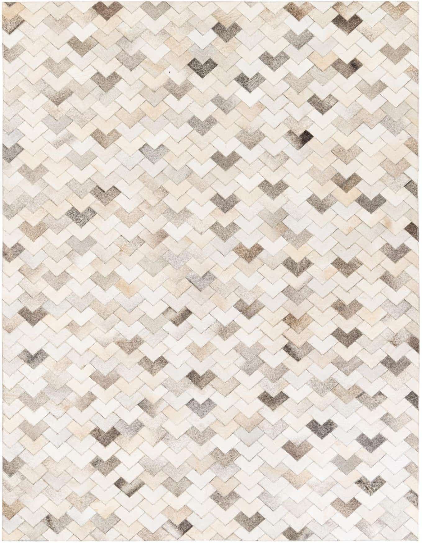 A 6x9 rectangular Cowhide Stocks rug featuring a modern chevron pattern in various shades of brown and tan.