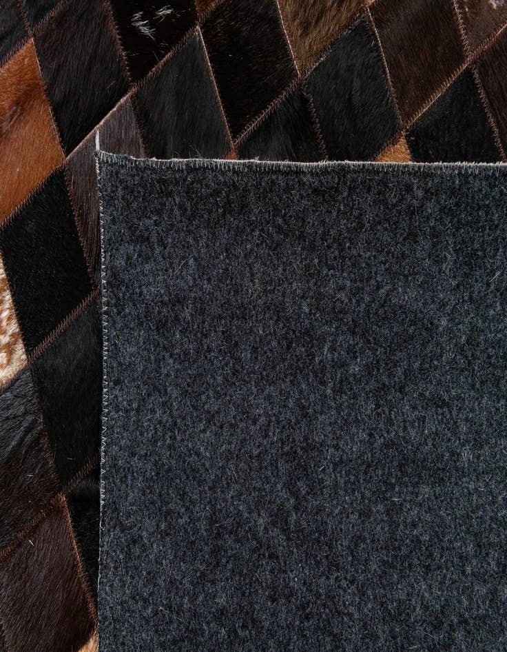 Detail image of  5' x 7' 11 Cowhide Stocks Rug