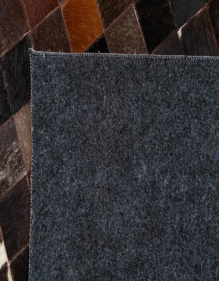 Detail image of  5' x 7' 11 Cowhide Stocks Rug