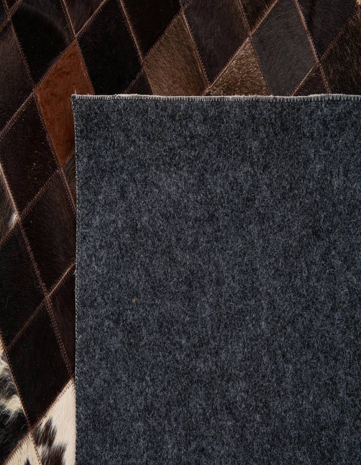 Detail image of  5' x 7' 11 Cowhide Stocks Rug