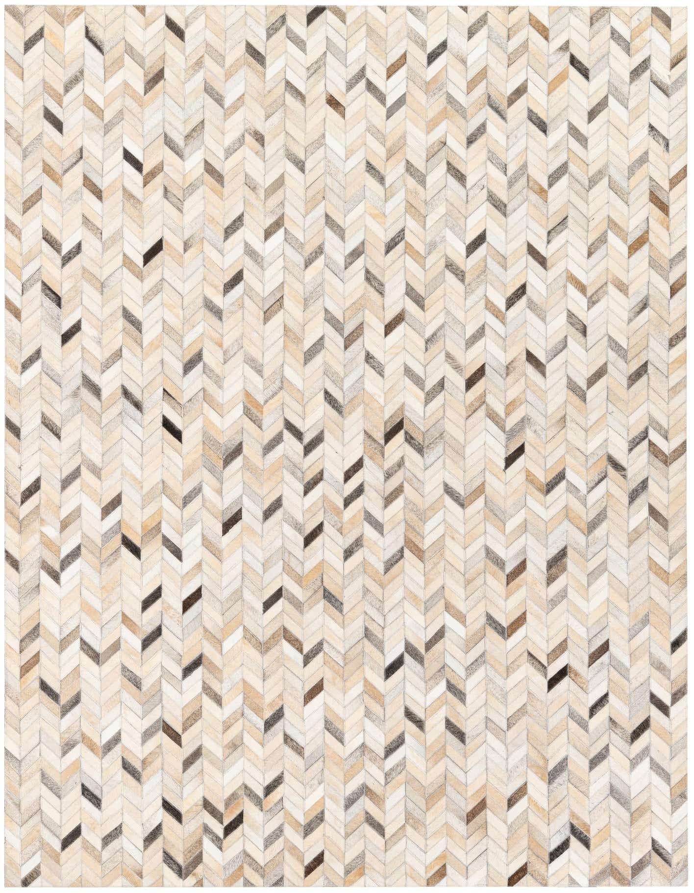 A 5x8 rectangular Cowhide Stocks rug by Rugs.com, featuring a modern chevron pattern in various shades of brown, tan, and cream.