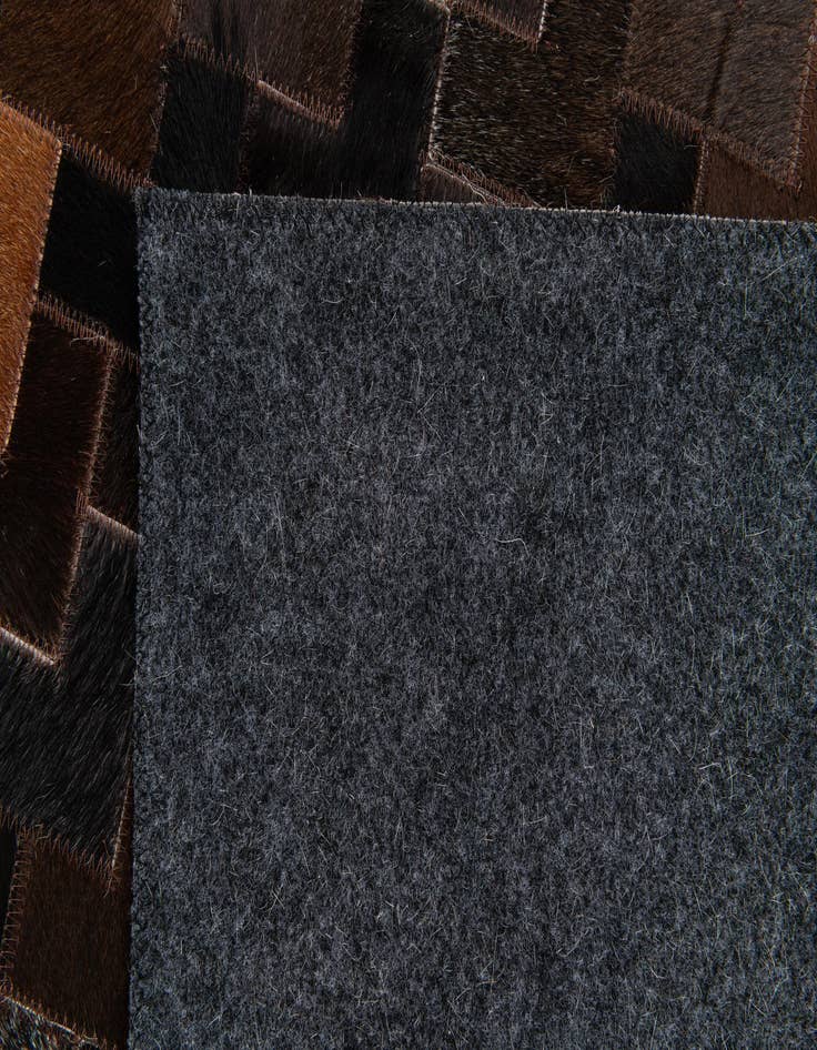Detail image of  5' x 7' 11 Cowhide Stocks Rug