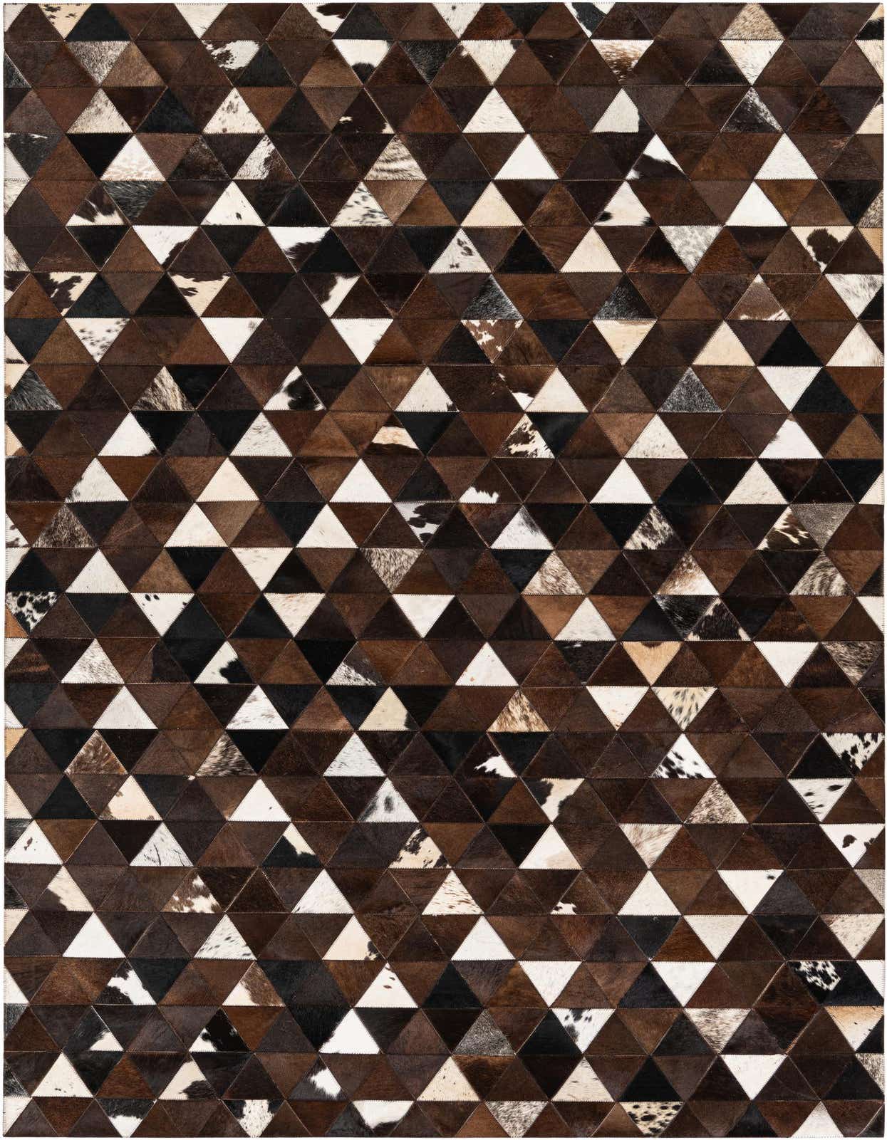A 5x8 rectangular Cowhide Stocks rug from Rugs.com, featuring a modern geometric pattern of brown, tan, black, and white cowhide triangles.