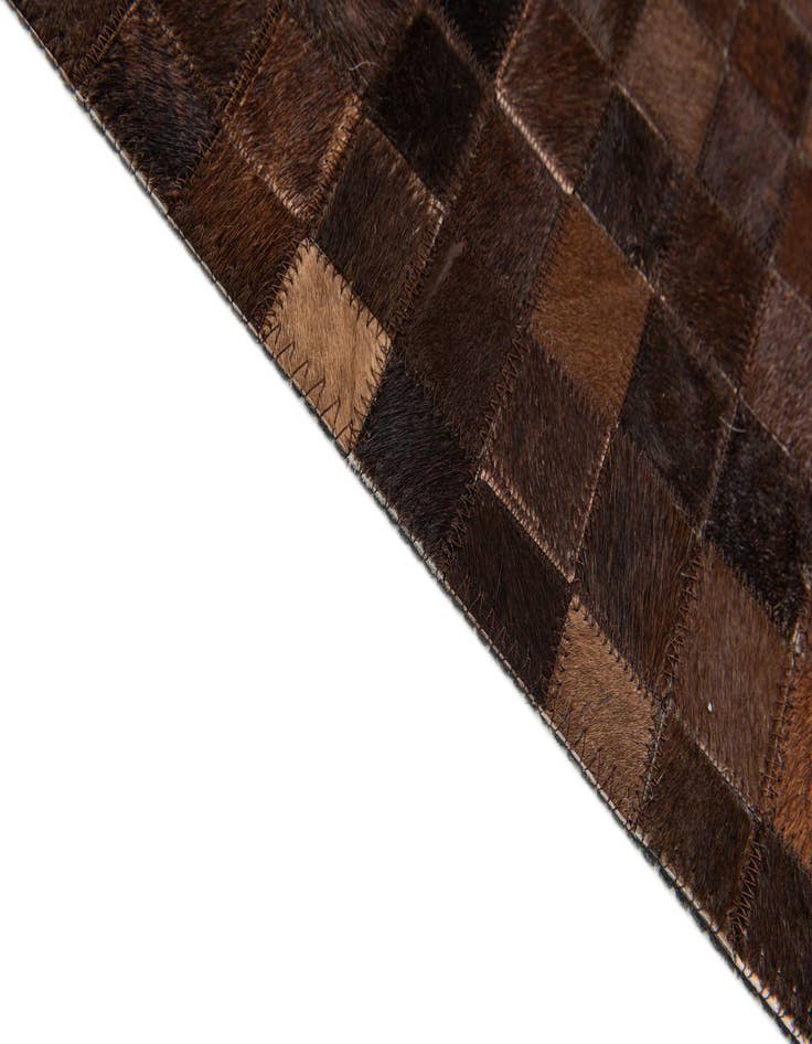 Detail image of  5' x 7' 11 Cowhide Stocks Rug