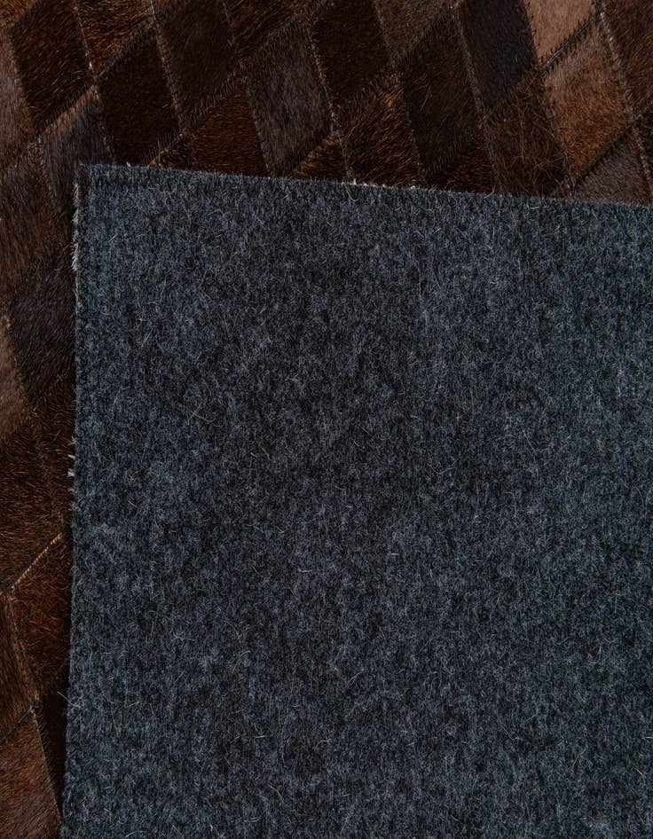 Detail image of  5' x 7' 11 Cowhide Stocks Rug