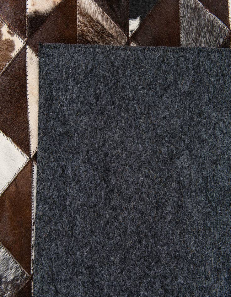 Detail image of  4' 11 x 8' Cowhide Stocks Rug