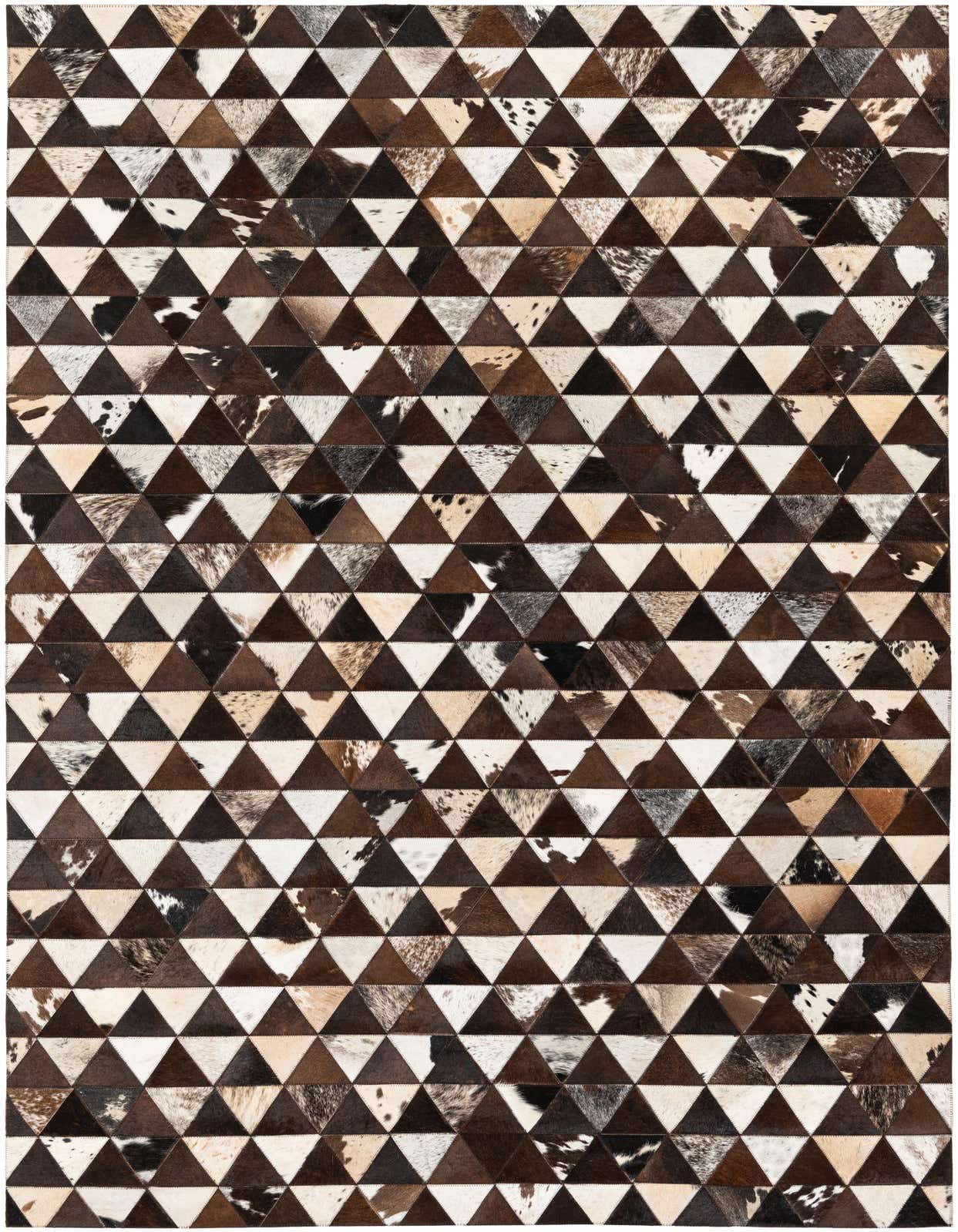 A 5x8 rectangular Cowhide Stocks rug featuring a modern geometric pattern of stitched brown, tan, and white triangular cowhide patches.