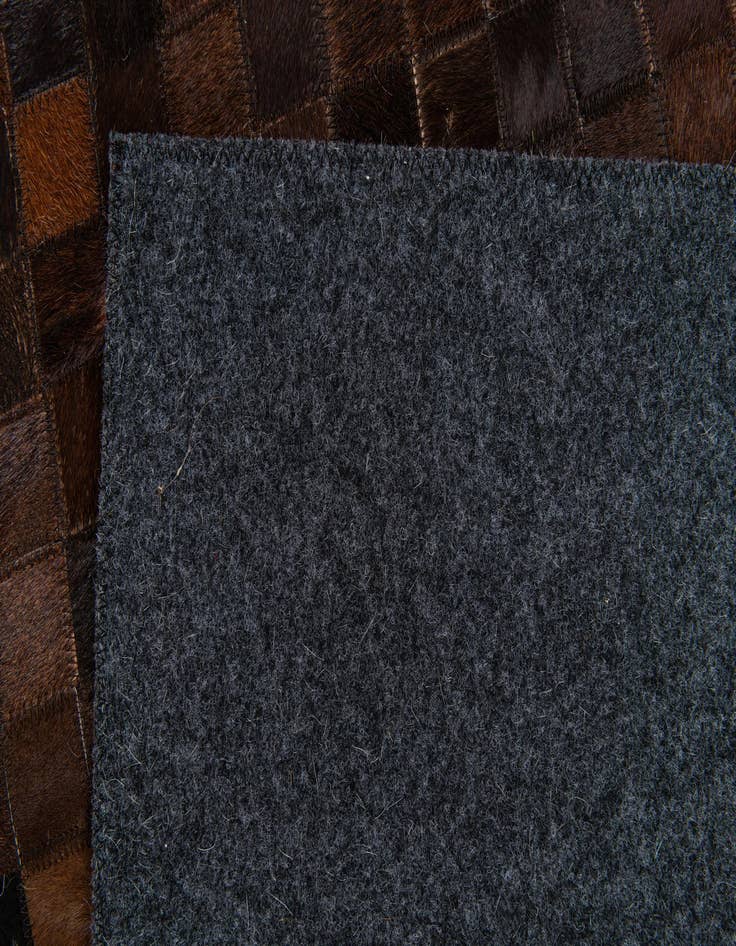 Detail image of  5' 1 x 7' 10 Cowhide Stocks Rug