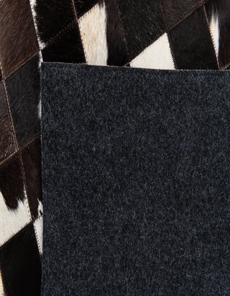 Detail image of  5' x 7' 11 Cowhide Stocks Rug