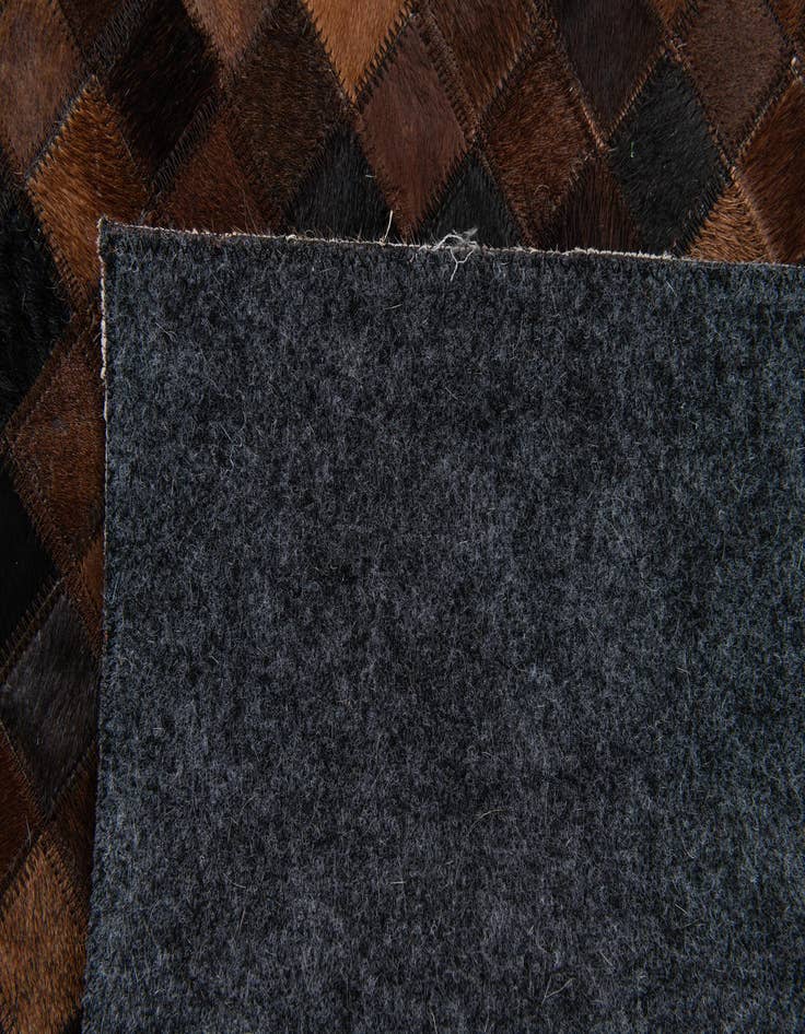 Detail image of  5' 1 x 8' Cowhide Stocks Rug