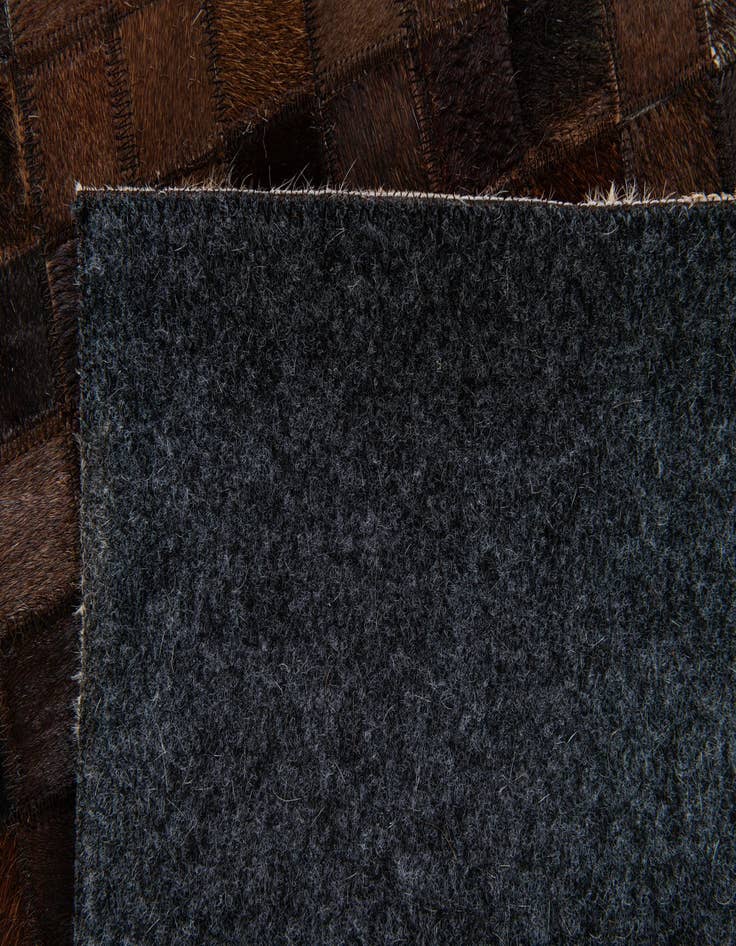 Detail image of  5' 1 x 8' Cowhide Stocks Rug