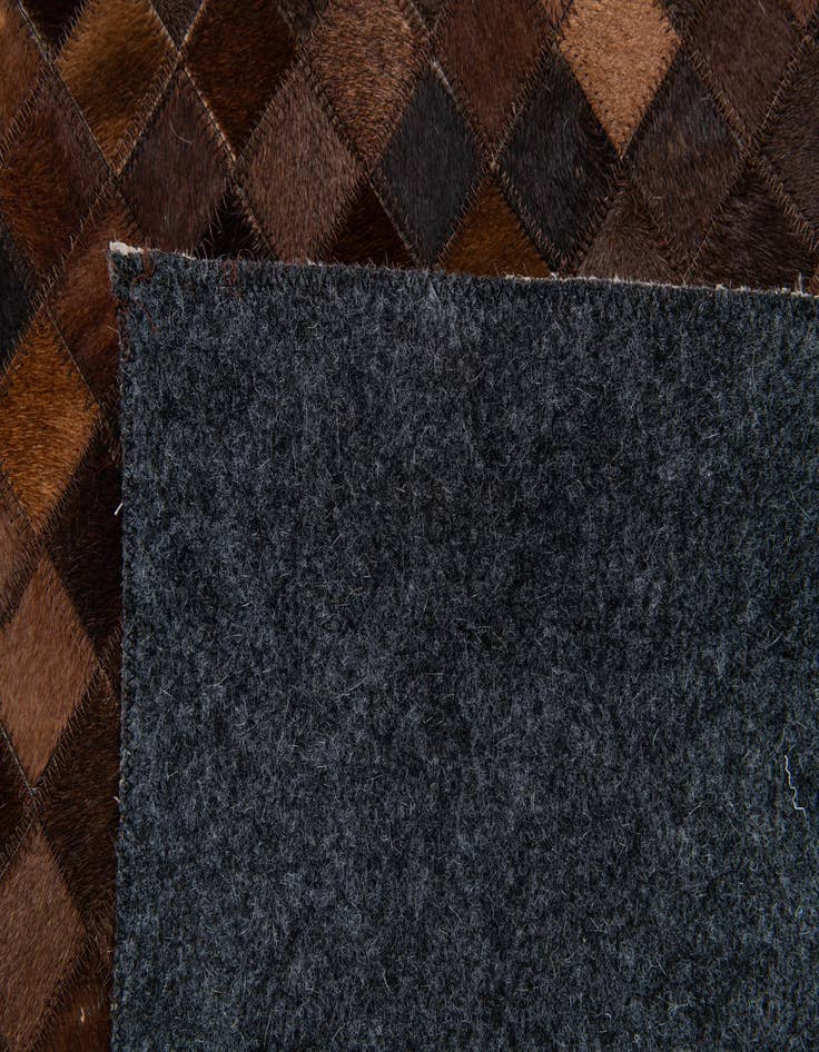 Detail image of  5' 1 x 8' 1 Cowhide Stocks Rug