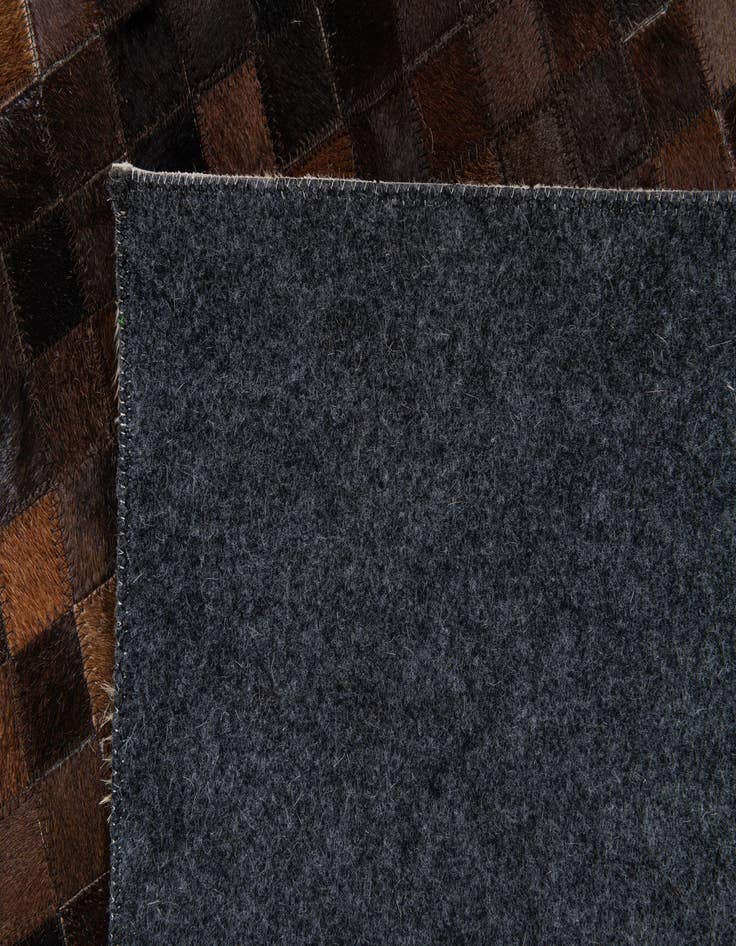Detail image of  5' 2 x 8' 1 Cowhide Stocks Rug