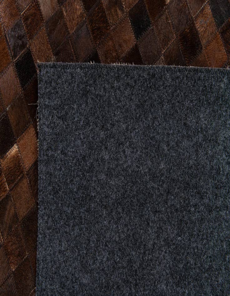 Detail image of  5' 1 x 8' Cowhide Stocks Rug