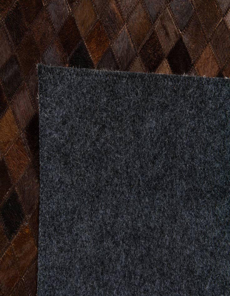 Detail image of  5' 2 x 8' Cowhide Stocks Rug