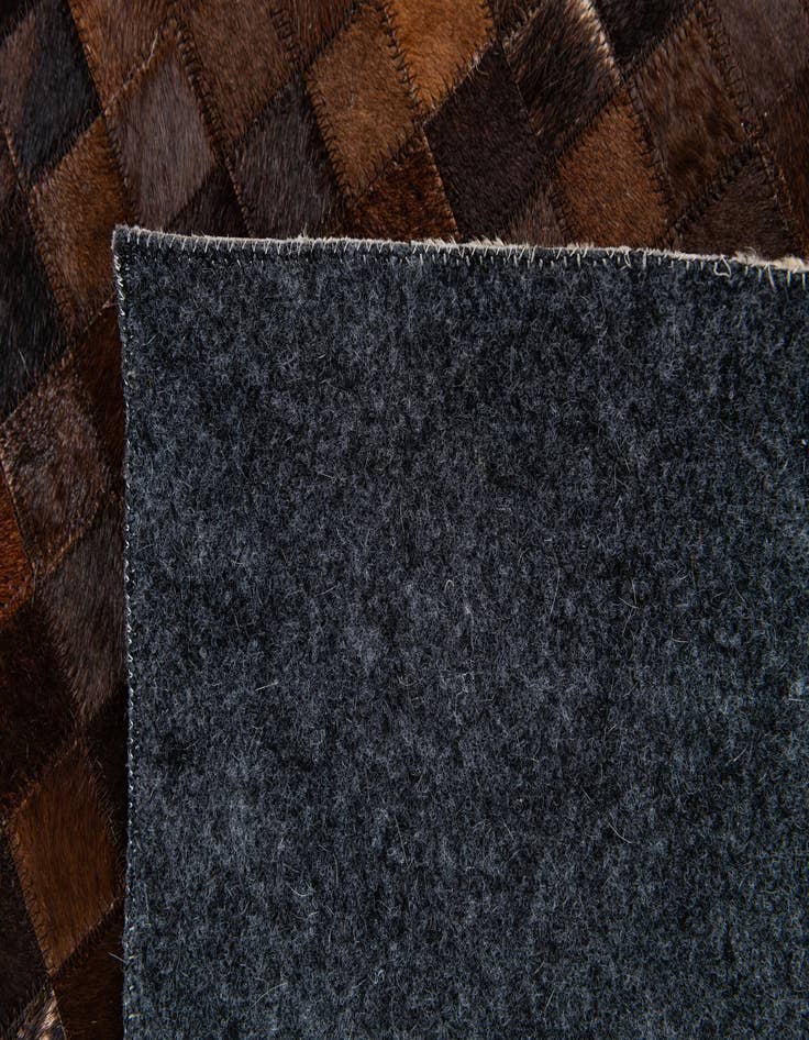 Detail image of  5' 2 x 8' 2 Cowhide Stocks Rug