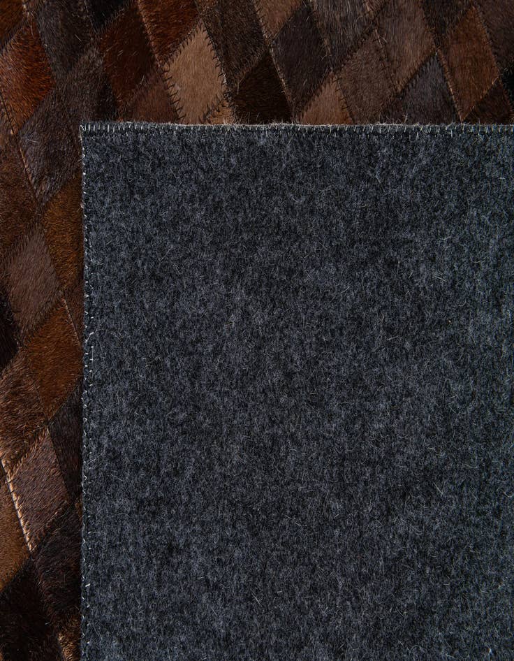 Detail image of  5' 1 x 8' Cowhide Stocks Rug