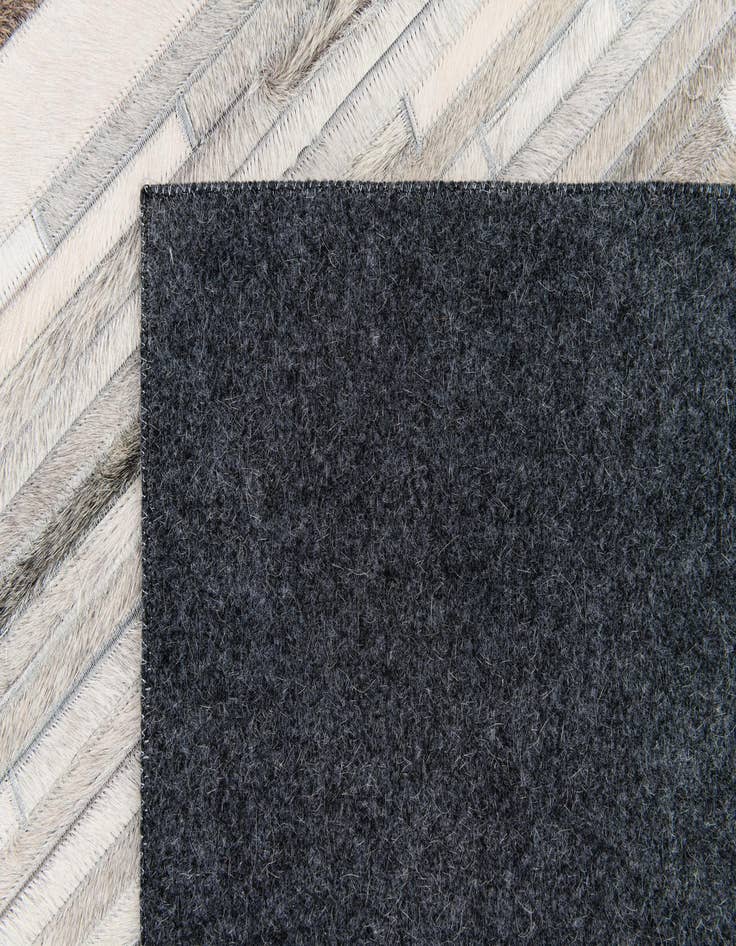 Detail image of  5' 1 x 8' Cowhide Stocks Rug