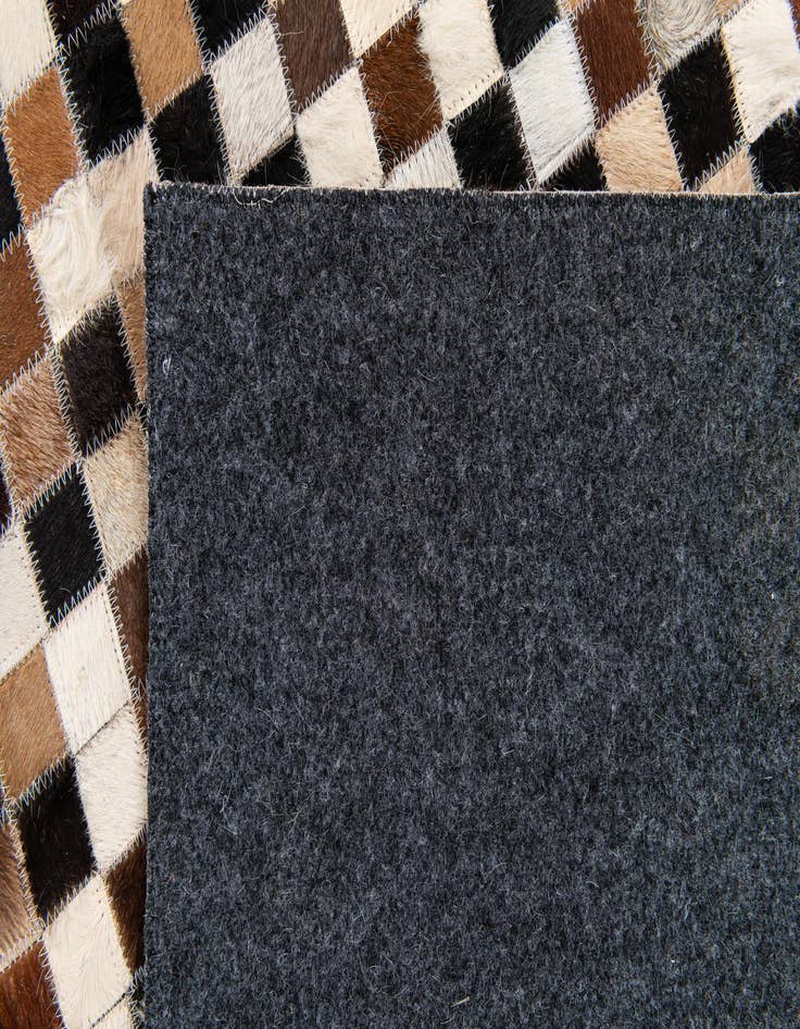 Detail image of  5' 3 x 7' 6 Cowhide Stocks Rug