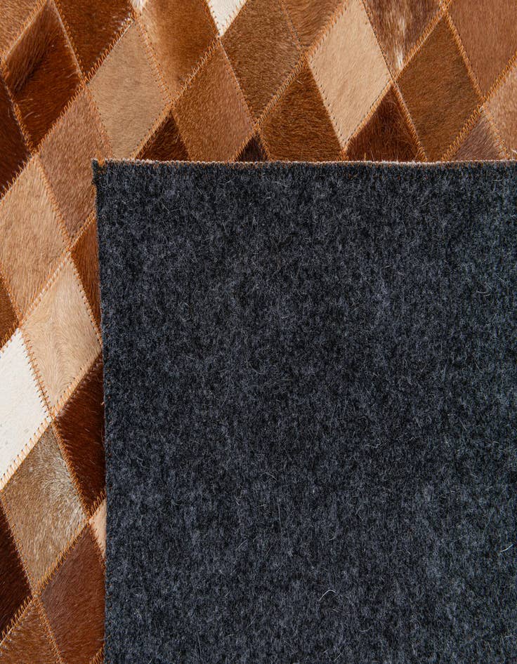 Detail image of  5' 1 x 8' 1 Cowhide Stocks Rug