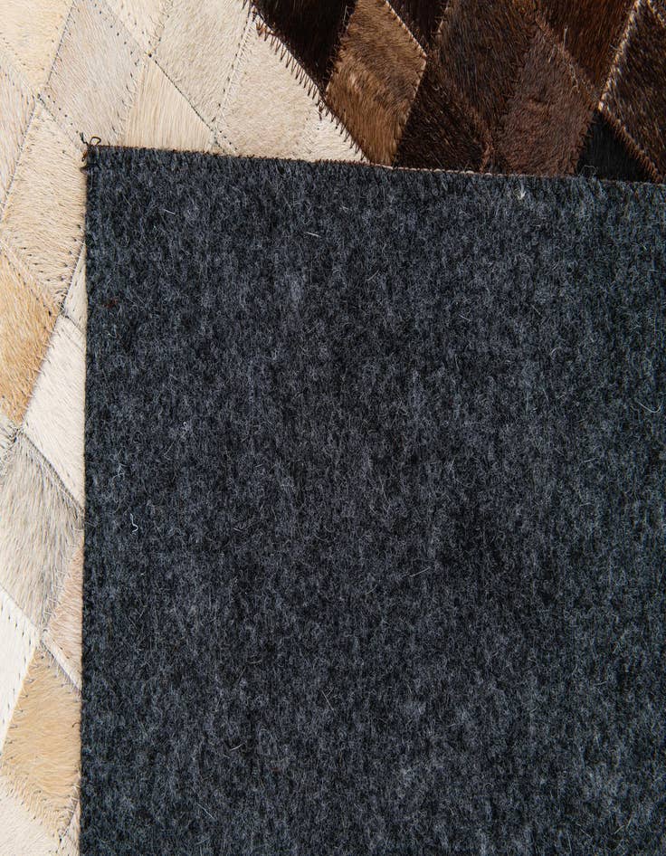 Detail image of  5' x 7' 11 Cowhide Stocks Rug