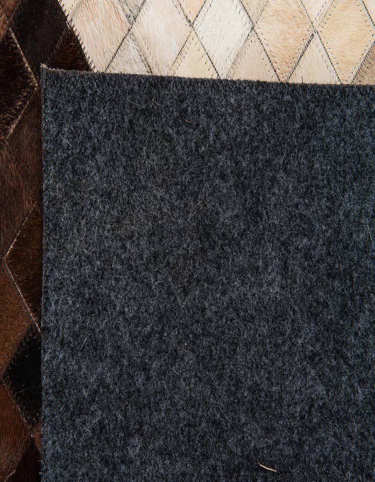 Detail image of  5' 2 x 8' 1 Cowhide Stocks Rug