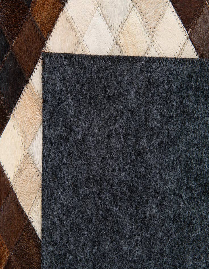 Detail image of  5' x 7' 11 Cowhide Stocks Rug