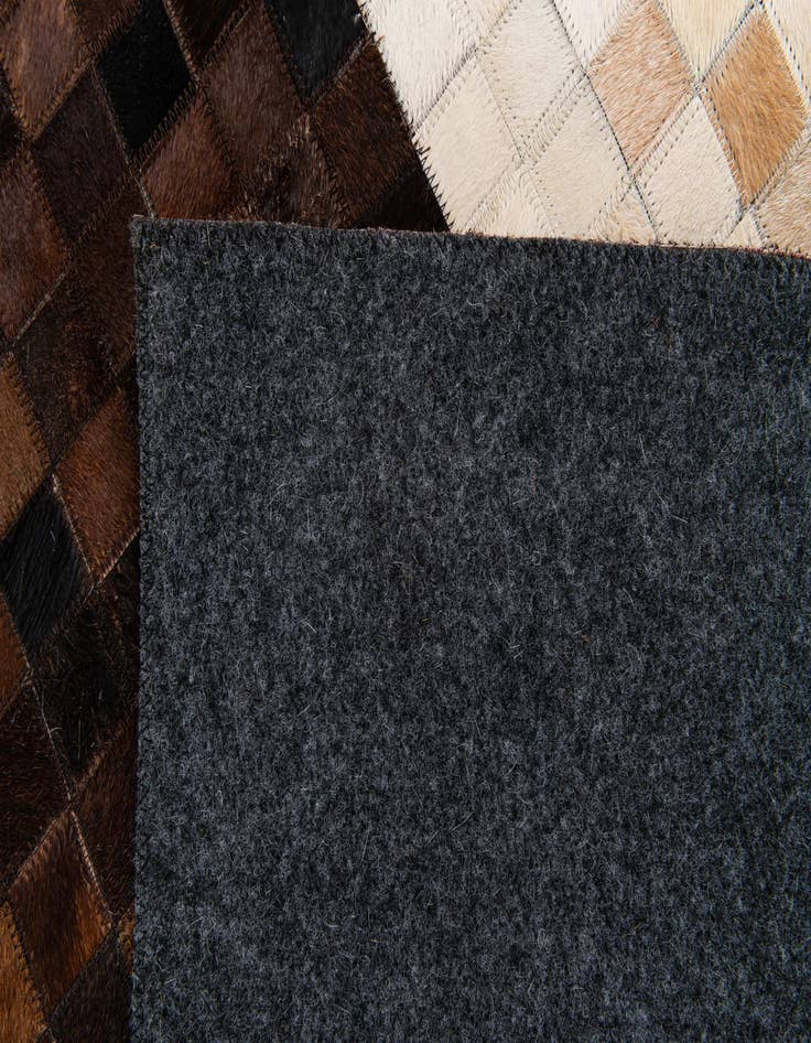 Detail image of  5' 1 x 8' Cowhide Stocks Rug