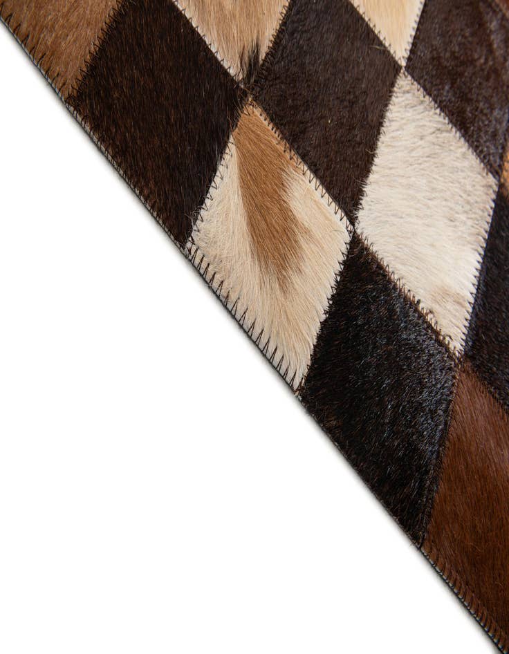 Detail image of  5' x 7' 11 Cowhide Stocks Rug