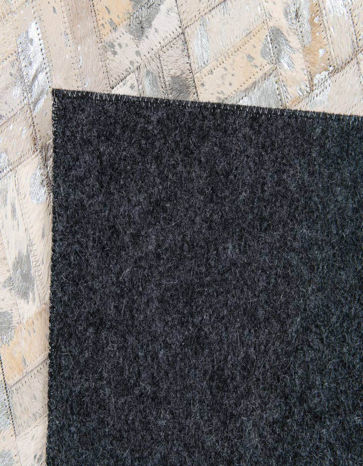 Detail image of  4' 11 x 8' 1 Cowhide Stocks Rug