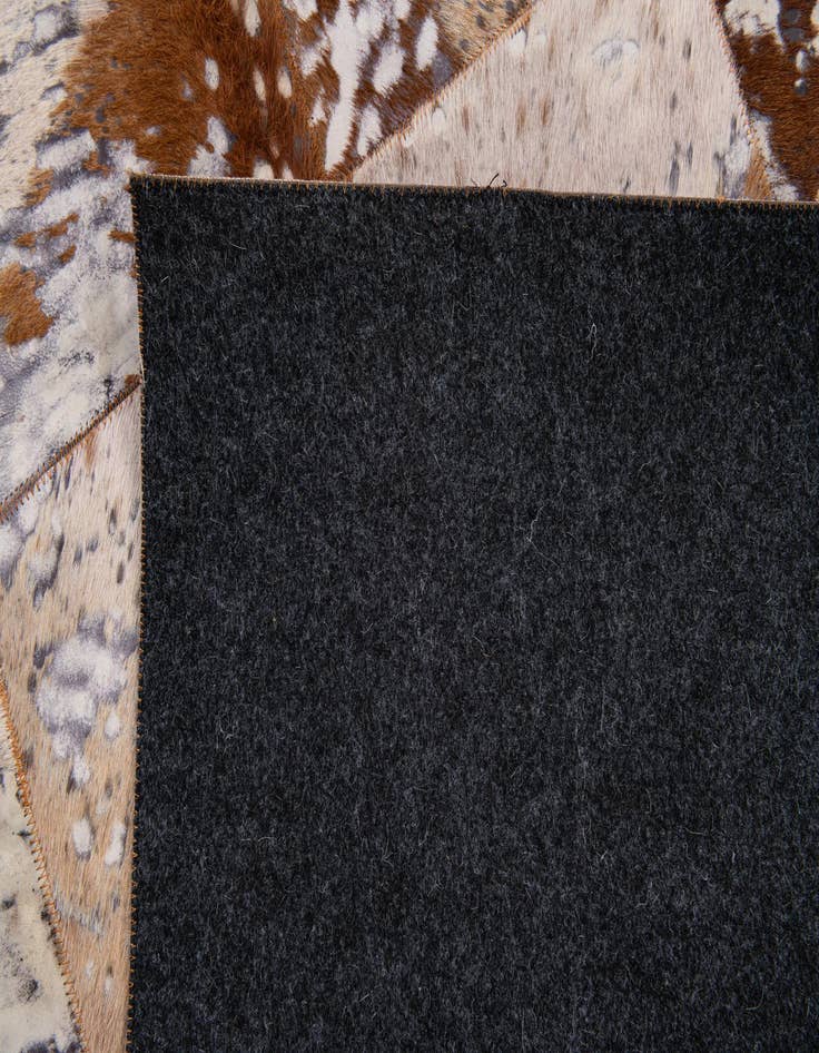 Detail image of  5' 2 x 8' Cowhide Stocks Rug