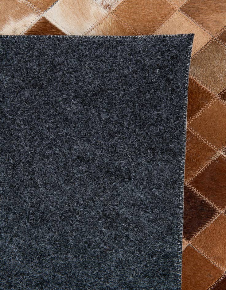 Detail image of  4' 11 x 8' Cowhide Stocks Rug