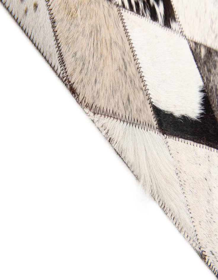 Detail image of  6' 9 x 9' 9 Cowhide Stocks Rug