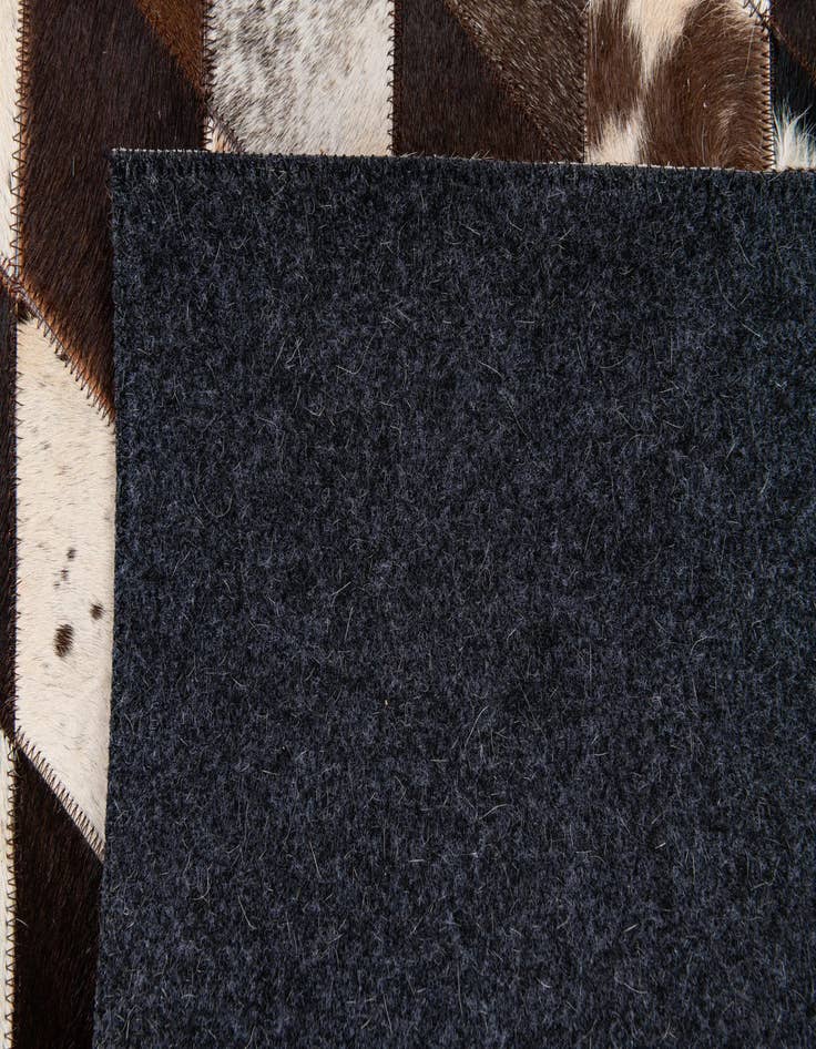 Detail image of  4' 8 x 6' 9 Cowhide Stocks Rug