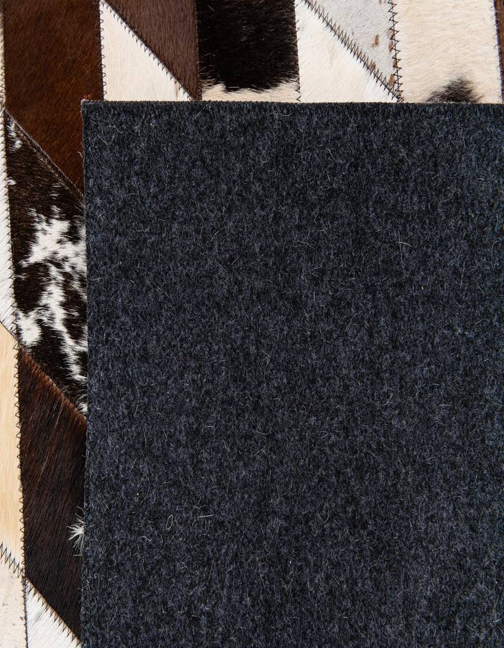 Detail image of  4' 8 x 6' 9 Cowhide Stocks Rug