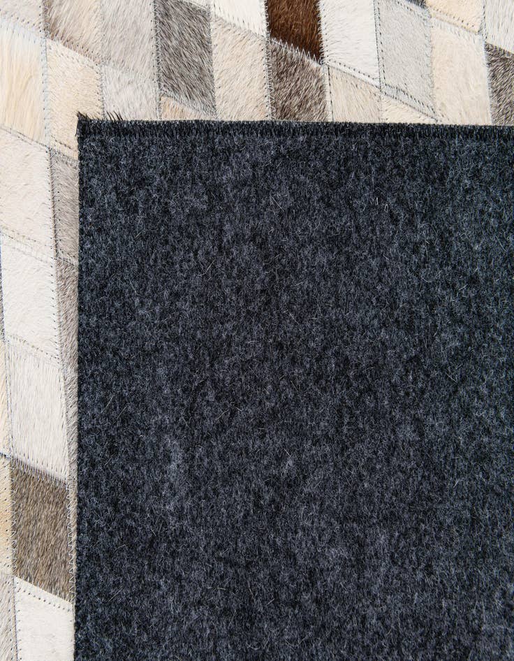 Detail image of  4' 7 x 6' 7 Cowhide Stocks Rug