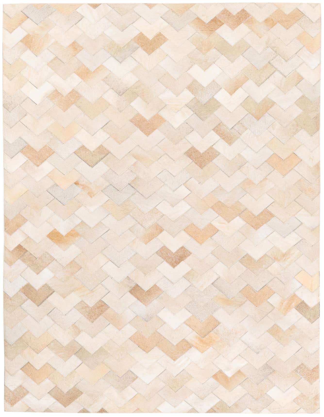 A 4x6 rectangular Cowhide Stocks rug featuring a modern chevron pattern in various shades of brown and tan.