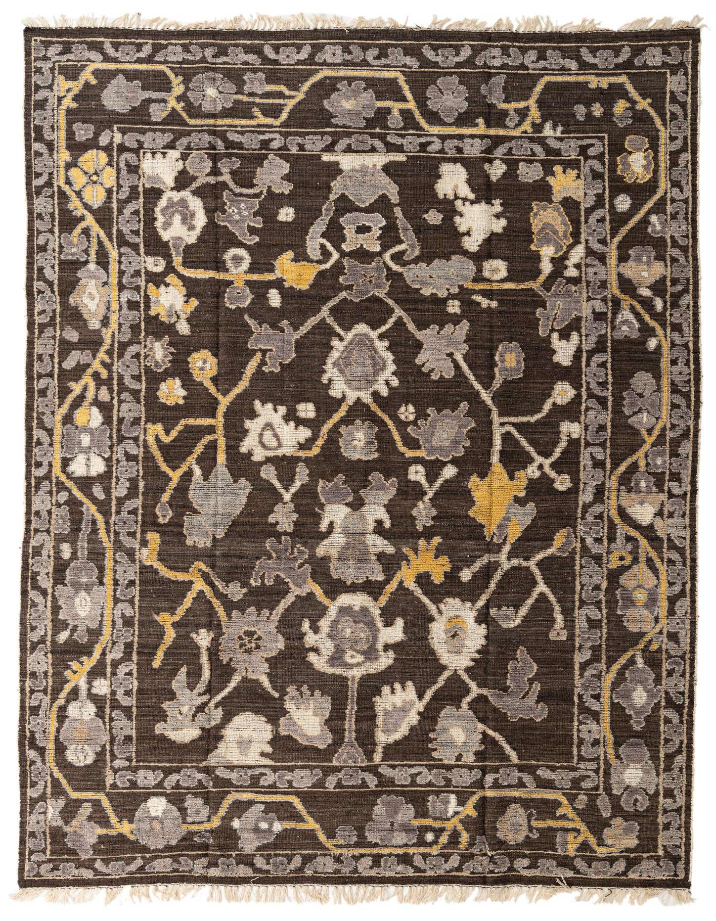 A 9x12 rectangular Darya rug with a modern floral pattern in shades of brown, tan, and yellow, with a high pile.