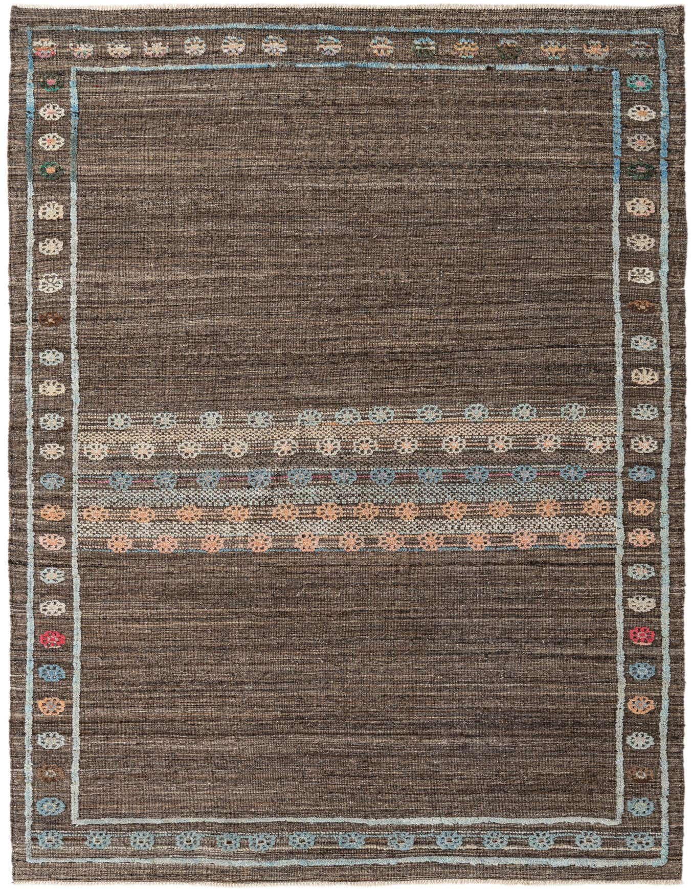 A 6x9 rectangular Darya rug with a high pile, featuring a brown and tan abstract pattern with colorful accents, ideal for a living room.