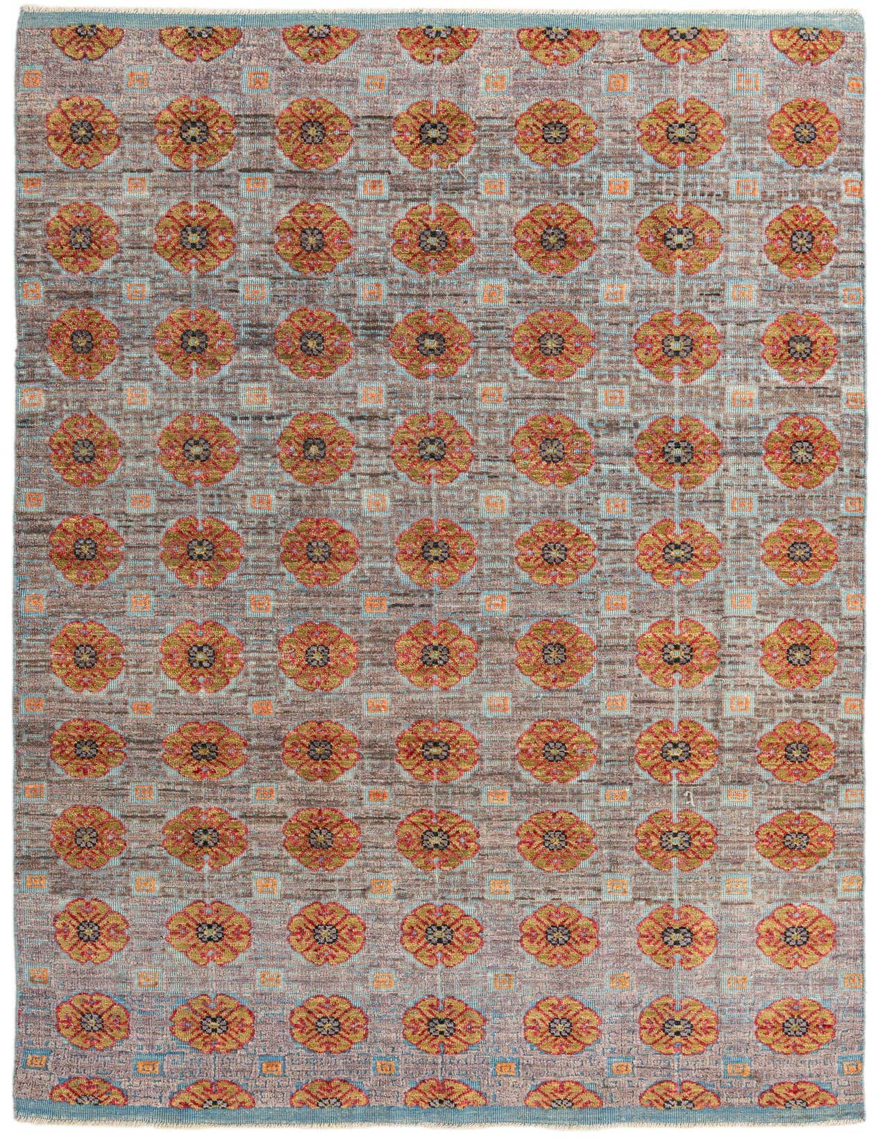 A 7x10 rectangular Darya rug with a textured brown and tan background, featuring repeating orange and gold floral medallions.