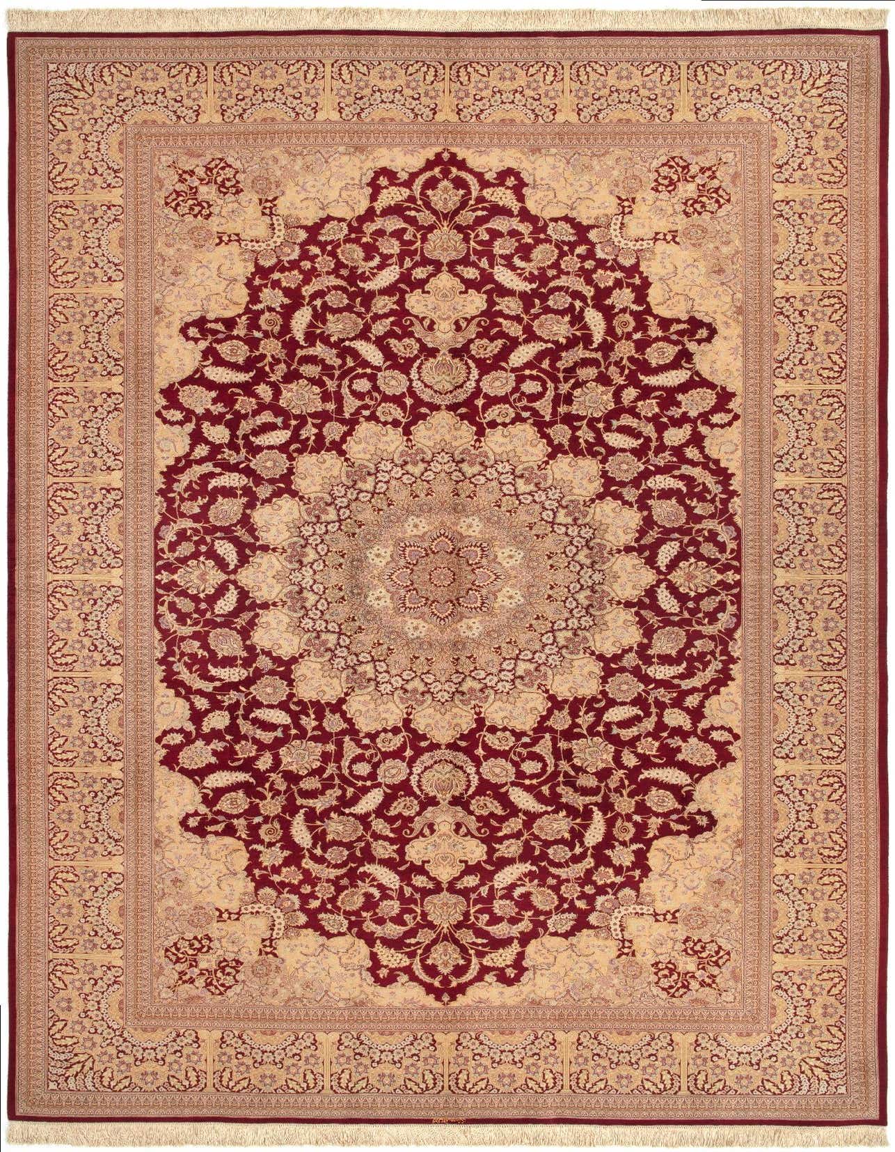 A 6x9 rectangular Ghom Silk Persian rug in rich browns and tans, featuring an intricate floral medallion pattern.
