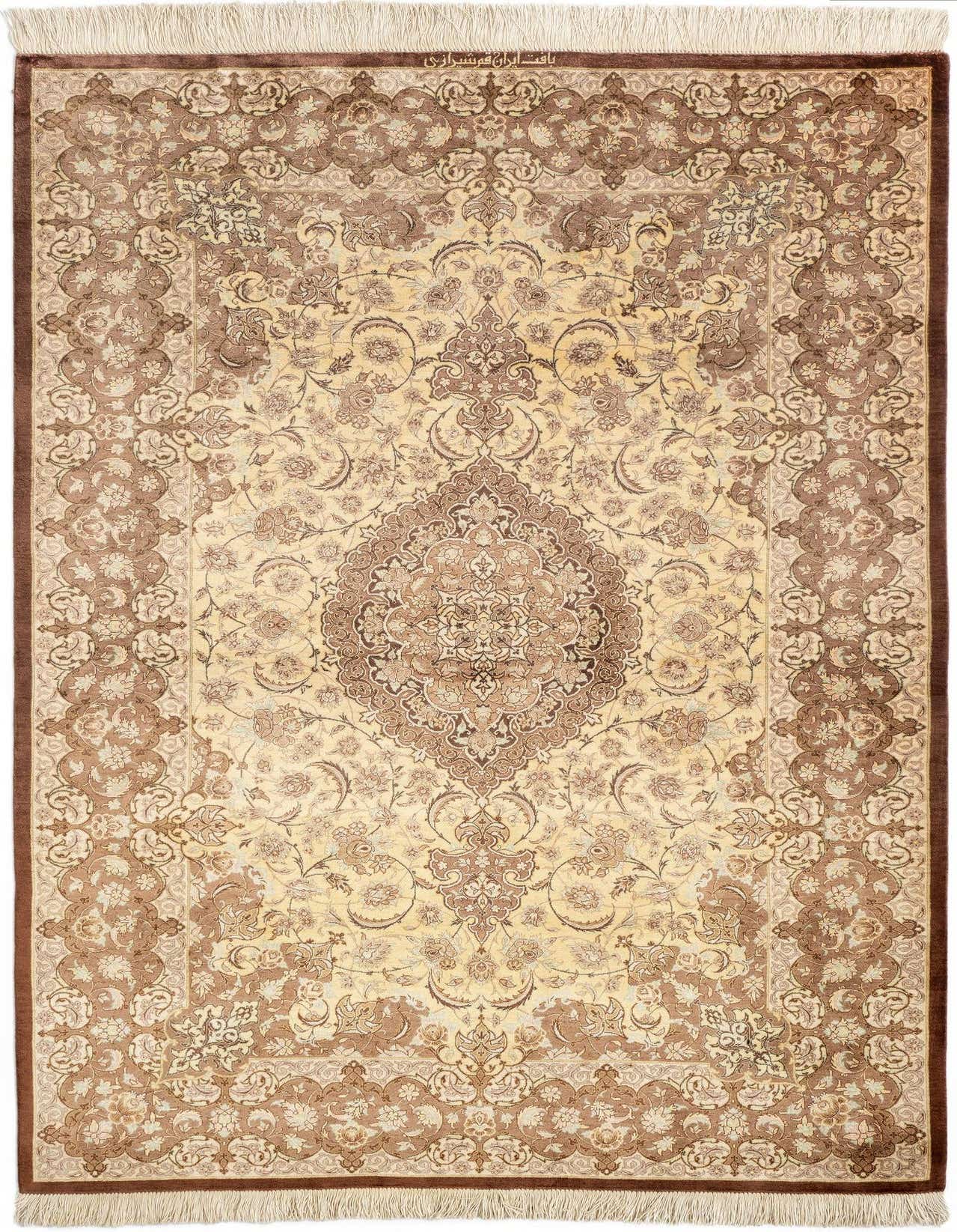 A 3x5 rectangular Ghom Silk Persian rug in shades of brown and tan, featuring an intricate floral medallion pattern and fringed edges.