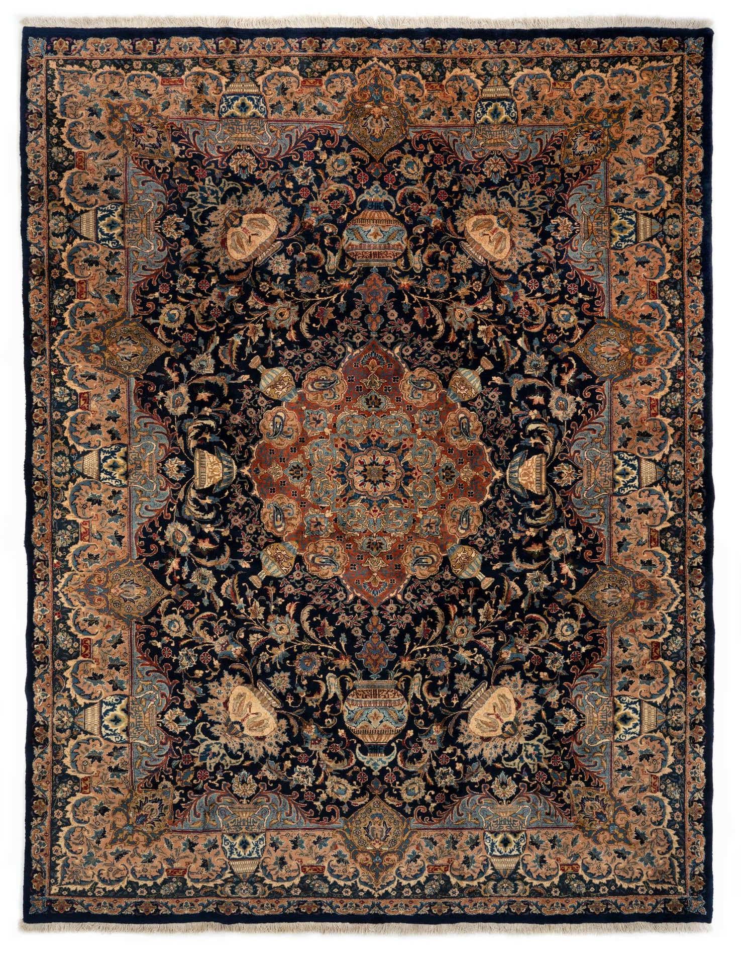 A 10x13 rectangular Kashmar Persian rug featuring a complex floral and medallion pattern in deep blues, browns, and tans.