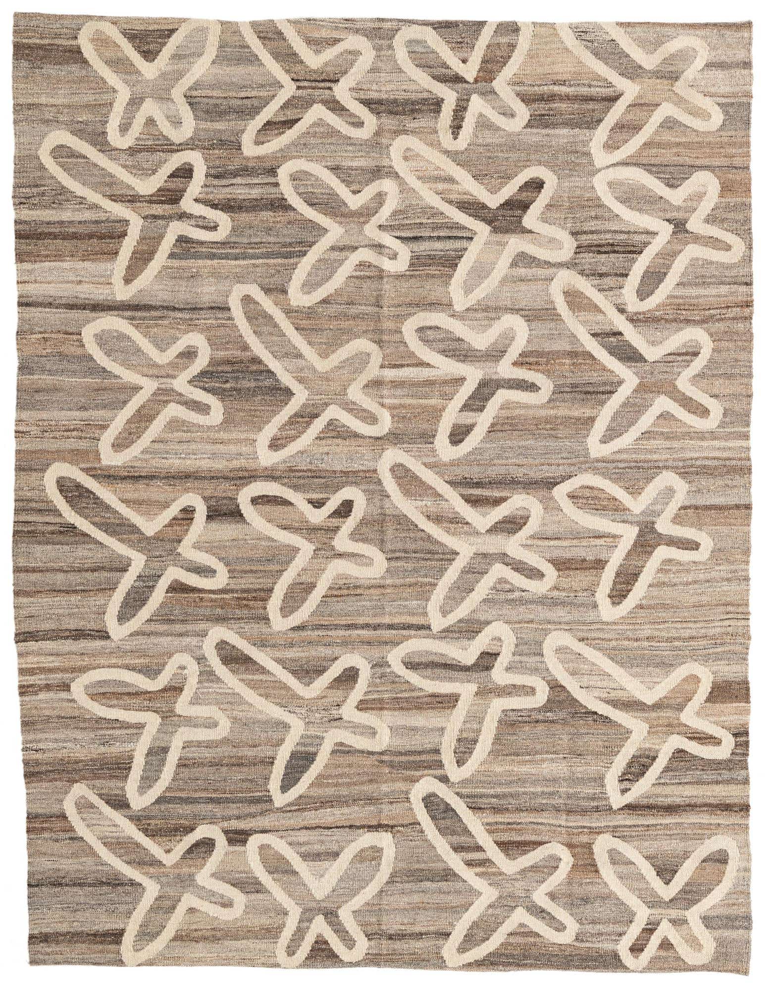 A 5x8 rectangular brown and tan wool flatweave rug with an abstract tribal pattern of light-colored X-shapes.