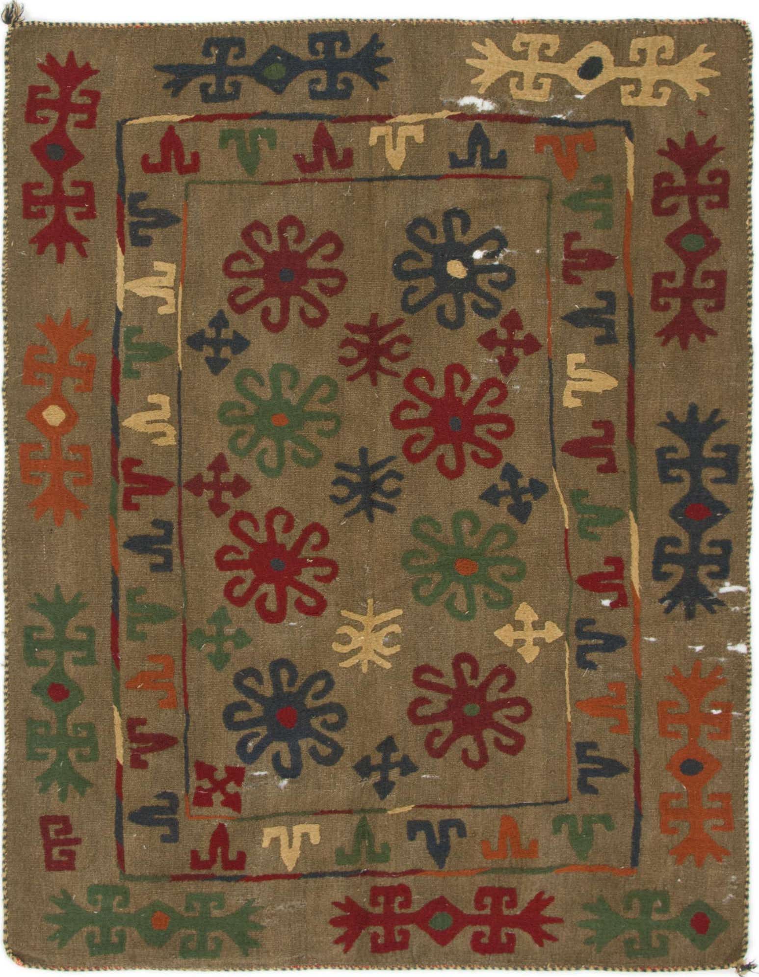 A 4x6 rectangular brown flatweave rug with a traditional botanical and tribal pattern, featuring colorful floral motifs in red, blue, green, and orange.