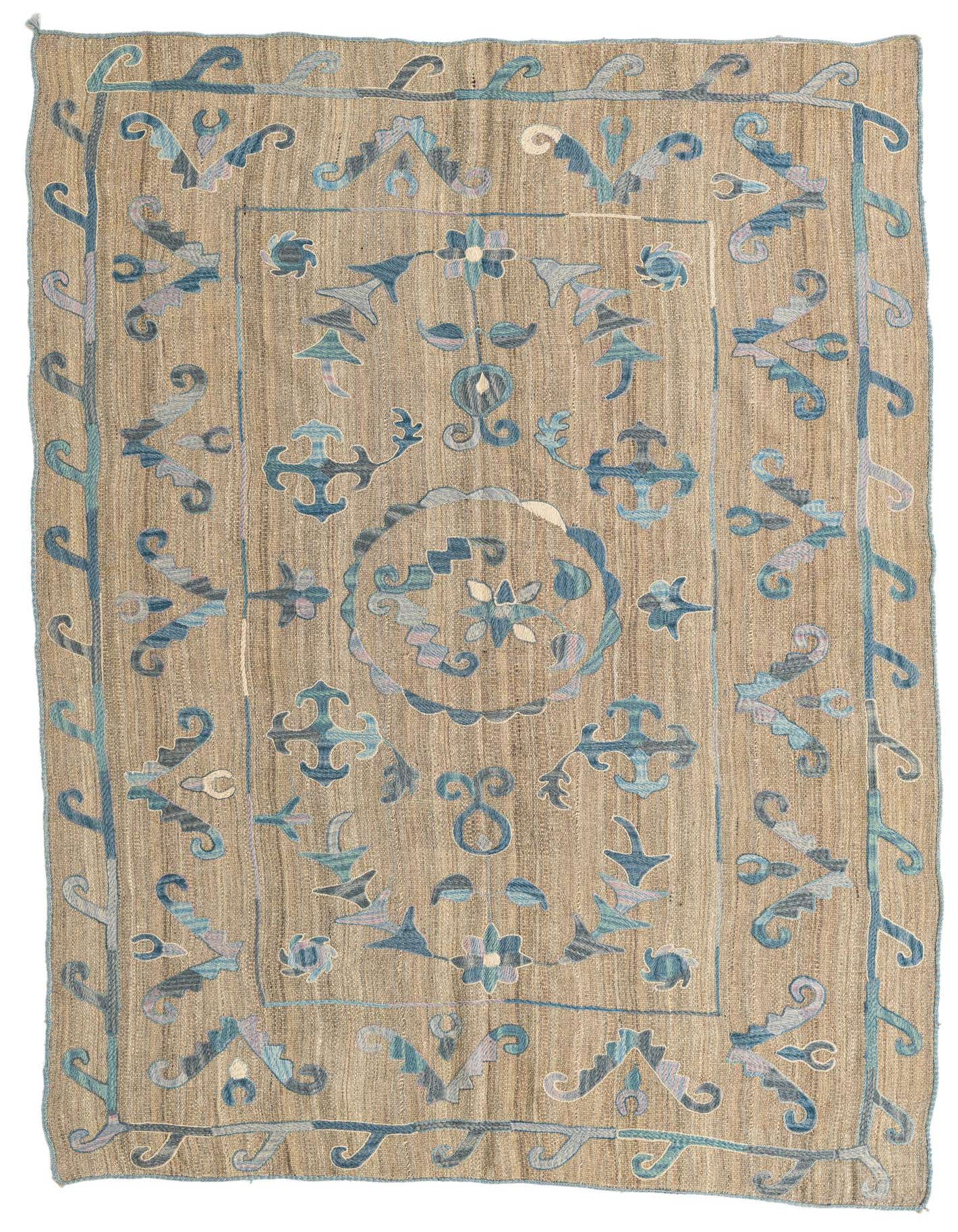 A 5x8 rectangular brown Kilim Suzani rug with a flatweave texture, featuring blue and teal tribal patterns and a central medallion.