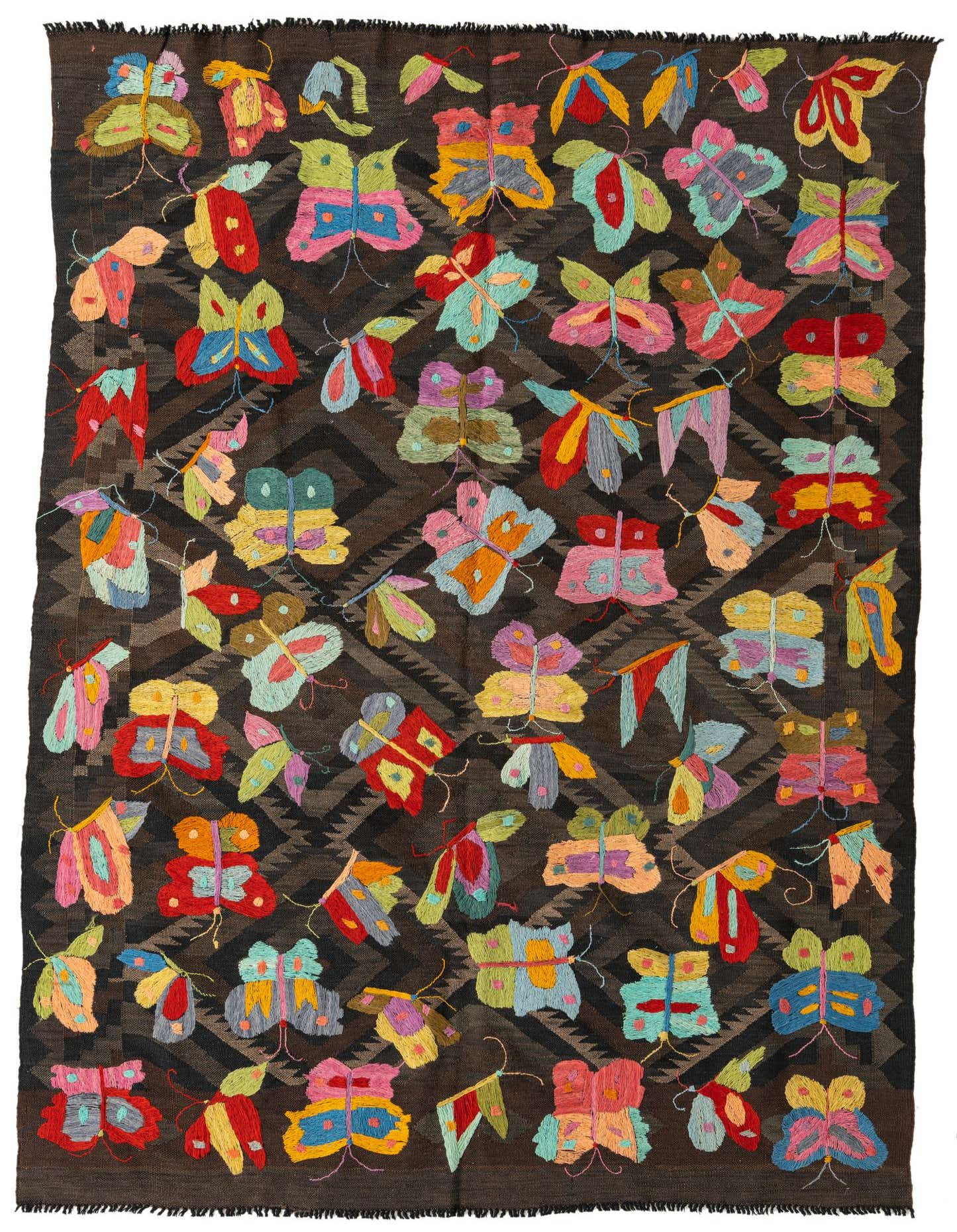 A 5x8 rectangular Kilim Suzani rug featuring a dark brown tribal pattern background with vibrant, colorful butterfly and moth embroidery.