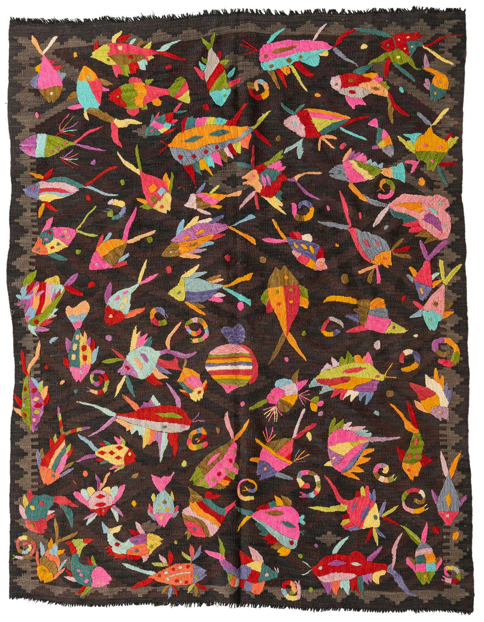 A 5x8 rectangular Kilim Suzani rug features a dark brown background with vibrant, colorful fish and abstract shapes.