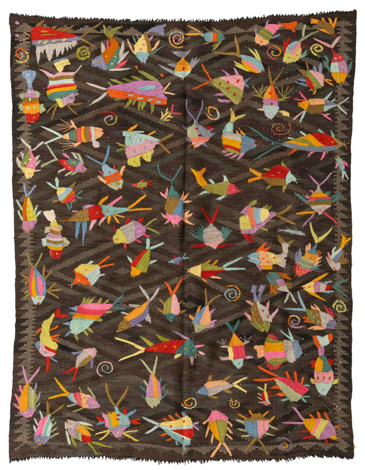 A 5x8 rectangular brown Kilim Suzani rug with a vibrant, colorful fish and swirl pattern, handmade from wool.