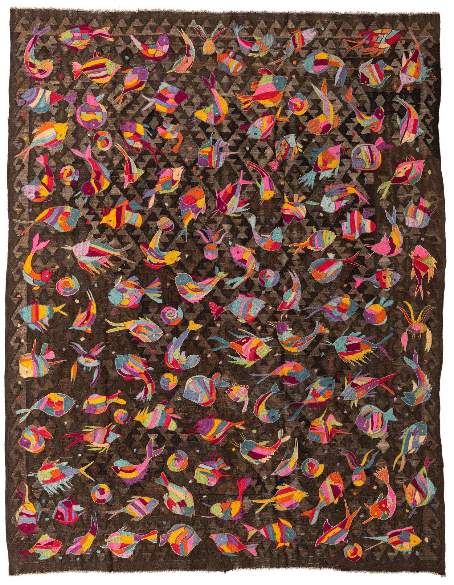 A 7x10 rectangular Kilim Suzani rug featuring a dark brown background with a subtle geometric pattern, adorned with numerous colorful, abstract fish and sea creature motifs in shades of pink, yellow, blue, and orange.